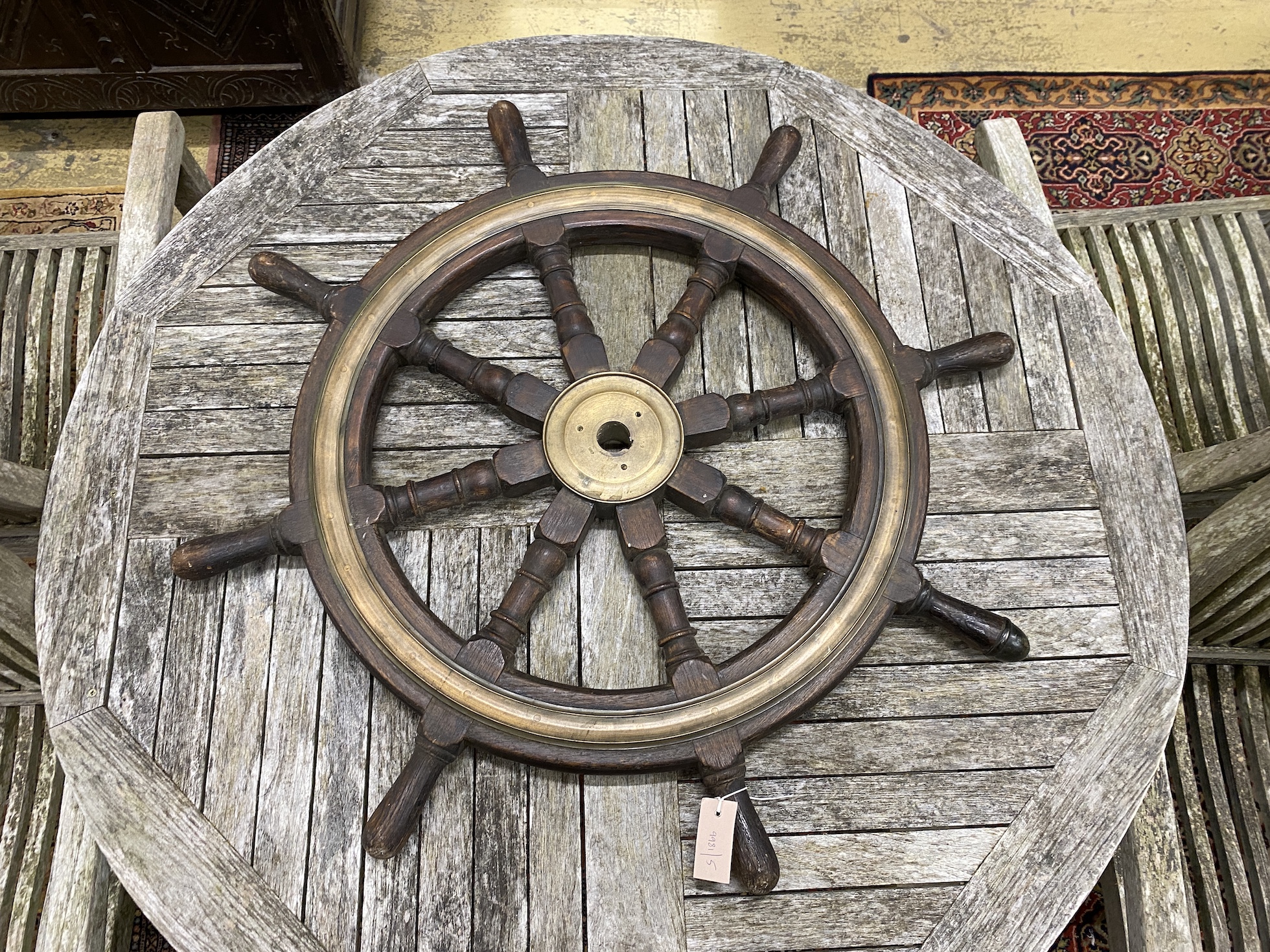 An early 20th century brass mounted teak ship's wheel, diameter 90cm